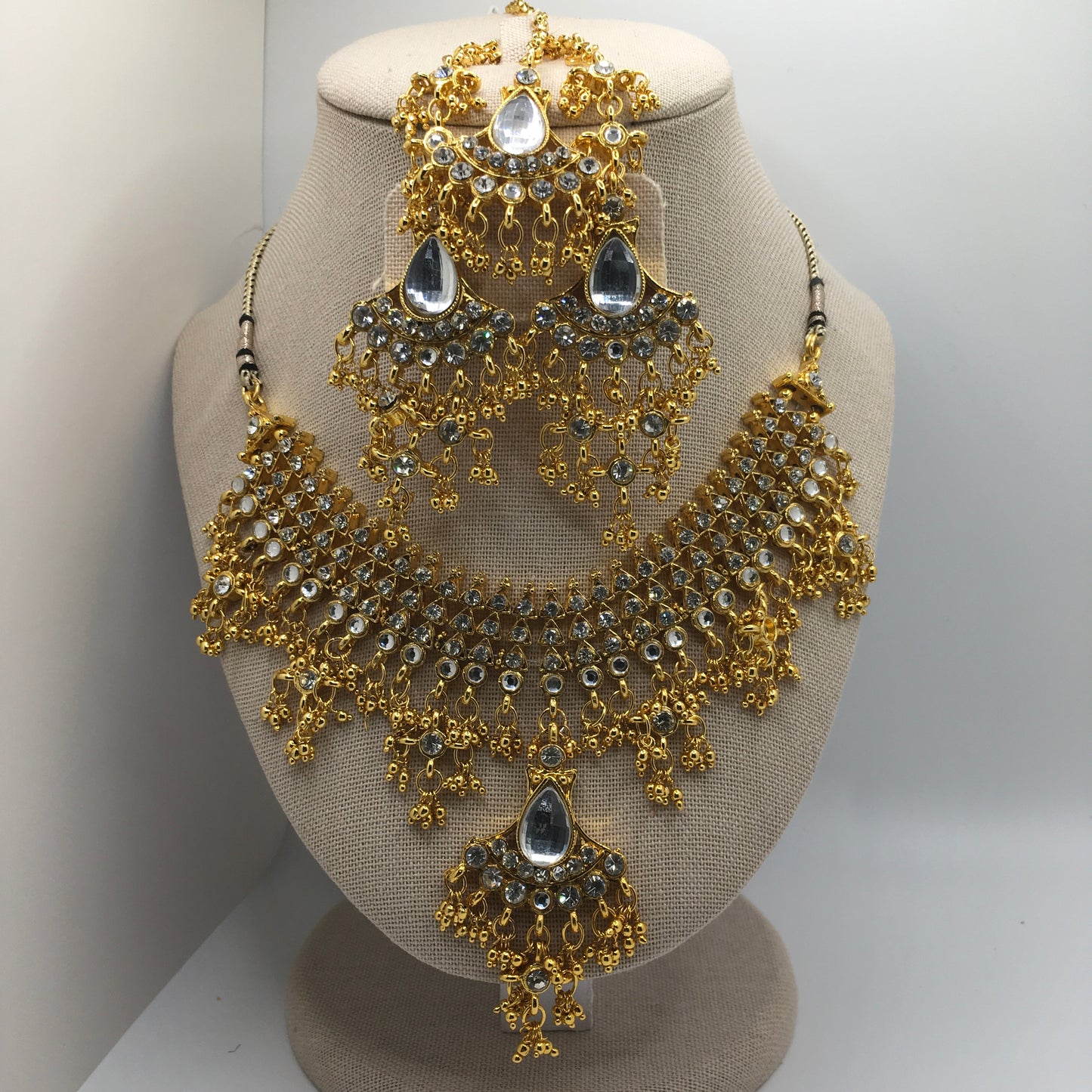 White Rhinestone & Gold color Necklace, Earrings & Tika Set